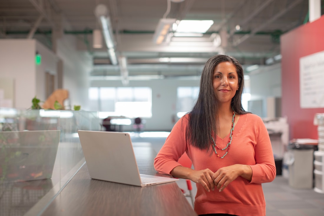 A professional standing at her workplace
